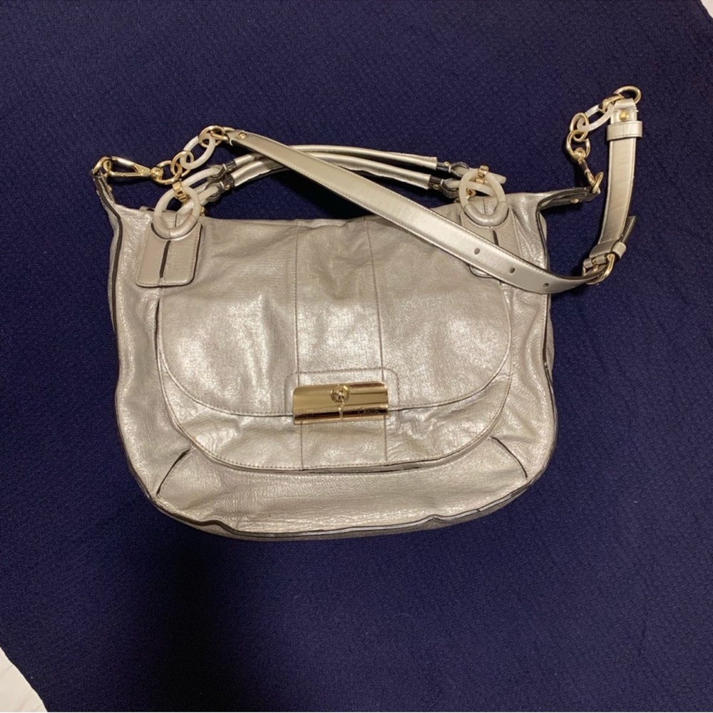 Coach Gold Shoulder Bag with Adjustable Strap and Luxurious Finish